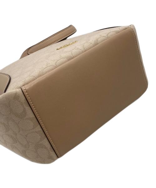 COACH（コーチ）COACH (コーチ) ハドリー ターンロック トート バッグ・シグネチャー キャンバス ベージュの古着・服飾アイテム