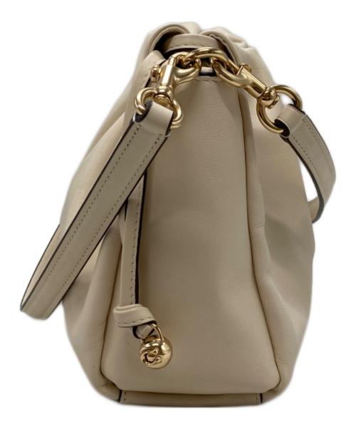 COACH（コーチ）COACH (コーチ) フェイ ドローストリング バッグ アイボリーの古着・服飾アイテム