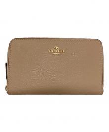 COACH（コーチ）の古着「ラウンドファスナー財布」｜ピンク