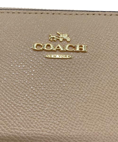 COACH（コーチ）COACH (コーチ) ラウンドファスナー財布 ピンクの古着・服飾アイテム