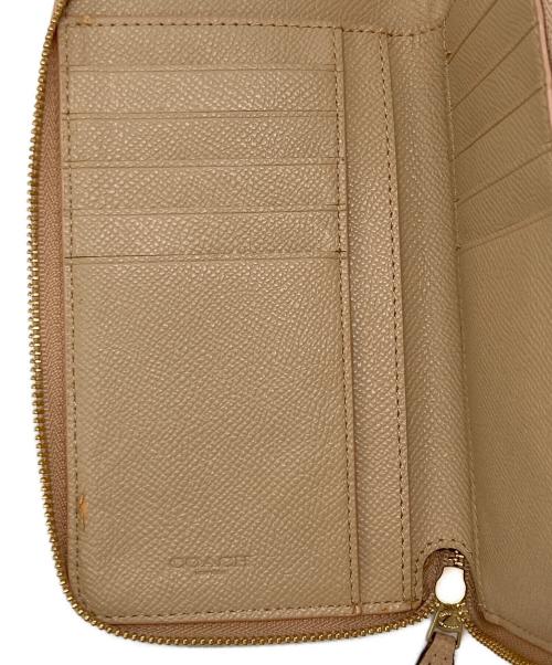 COACH（コーチ）COACH (コーチ) ラウンドファスナー財布 ピンクの古着・服飾アイテム