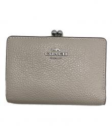 COACH（コーチ）の古着「二つ折り財布」