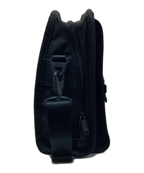 TUMI（トゥミ）TUMI (トゥミ) スモール・フラップ・ボディバッグ ブラックの古着・服飾アイテム