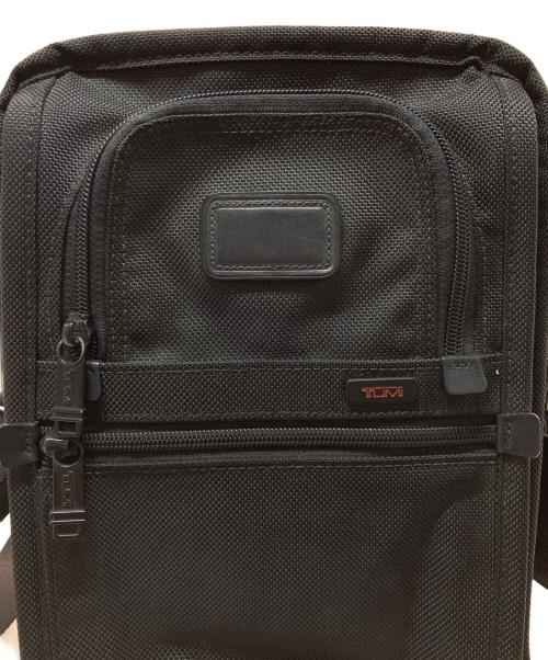 TUMI（トゥミ）TUMI (トゥミ) スモール・フラップ・ボディバッグ ブラックの古着・服飾アイテム