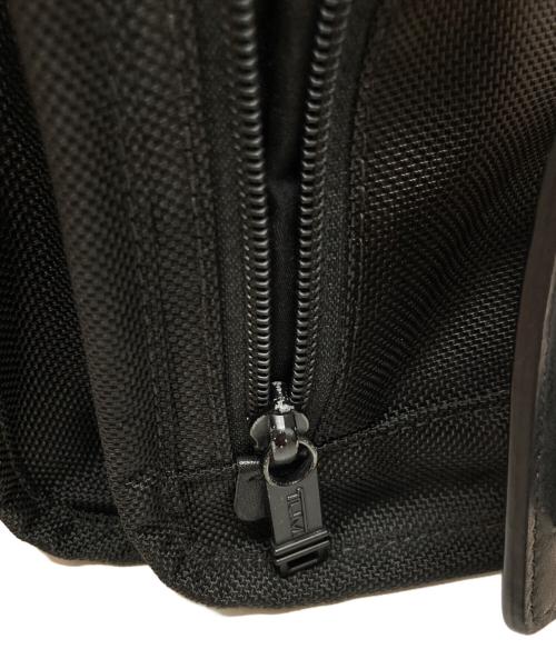 TUMI（トゥミ）TUMI (トゥミ) スモール・フラップ・ボディバッグ ブラックの古着・服飾アイテム