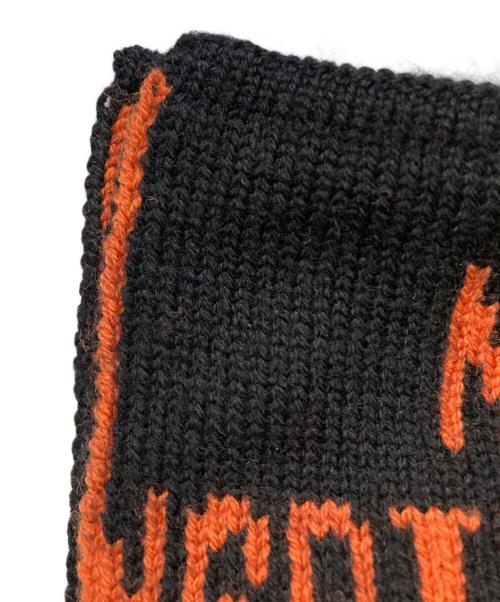 CHRISTIAN DADA（クリスチャンダダ）CHRISTIAN DADA (クリスチャンダダ) Quotes Jacquard Long Knit Scarf ブラック×オレンジの古着・服飾アイテム