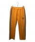 PUMA（プーマ）の古着「TRACK PANTS」｜オレンジ