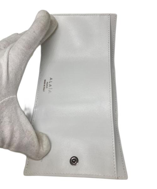 ALAIA（アライア）ALAIA (アライア) Wホックウォレット ホワイトの古着・服飾アイテム