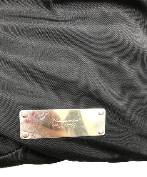 UNDERCOVERISM（アンダーカバーイズム）UNDERCOVERISM (アンダーカバーイズム) ロゴプレートナイロンバックパック ブラックの古着・服飾アイテム