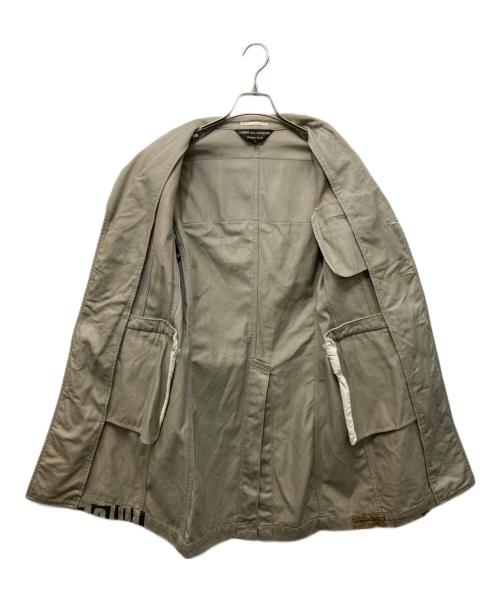 COMME des GARCONS HOMME PLUS（コムデギャルソンオムプリュス）COMME des GARCONS HOMME PLUS (コムデギャルソンオムプリュス) 2008AW ペイントデザインロングジャケット ベージュ サイズ:Sの古着・服飾アイテム