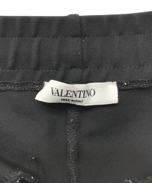 VALENTINO（ヴァレンティノ）VALENTINO (ヴァレンティノ) VLTN ロゴトラックパンツ ブラック×ホワイト サイズ:Sの古着・服飾アイテム