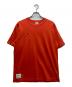 Champion（チャンピオン）の古着「Tシャツ」｜オレンジ