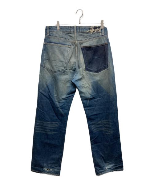 stussy（ステューシー）stussy (ステューシー) バッグブランドプリントデニムパンツ インディゴ サイズ:34の古着・服飾アイテム