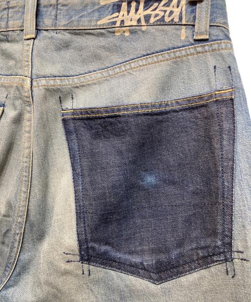stussy（ステューシー）stussy (ステューシー) バッグブランドプリントデニムパンツ インディゴ サイズ:34の古着・服飾アイテム