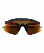 OAKLEYオークリー）の古着「スポーツサングラス」｜オレンジ