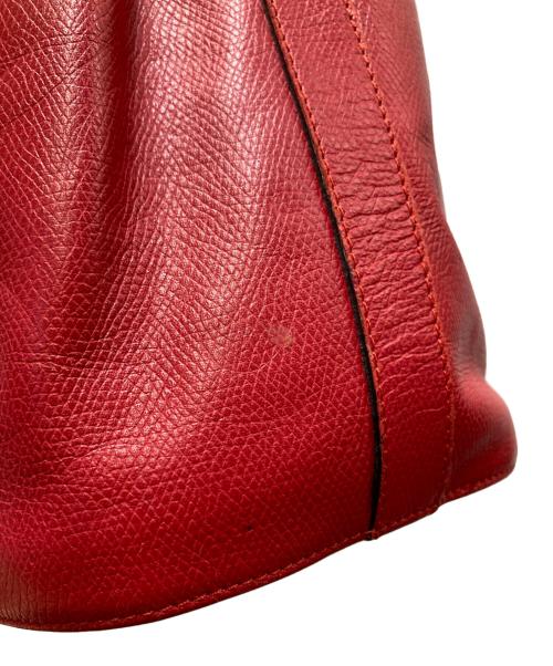 Yves Saint Laurent（イヴサンローラン）Yves Saint Laurent (イヴサンローラン) 巾着レザーショルダーバッグ レッドの古着・服飾アイテム