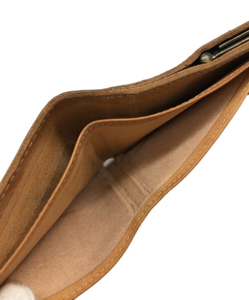 IL BISONTE（イル ビゾンテ）IL BISONTE (イル ビゾンテ) ランダムロゴレザーウォレットの古着・服飾アイテム