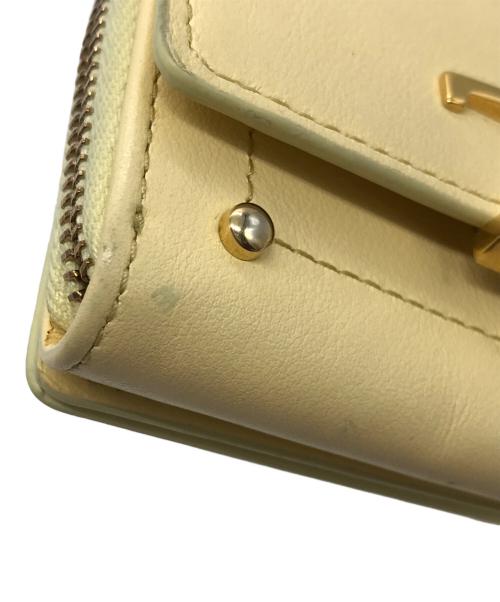 TOD'S（トッズ）TOD'S (トッズ) Tタイムレス2つ折り財布 イエローの古着・服飾アイテム