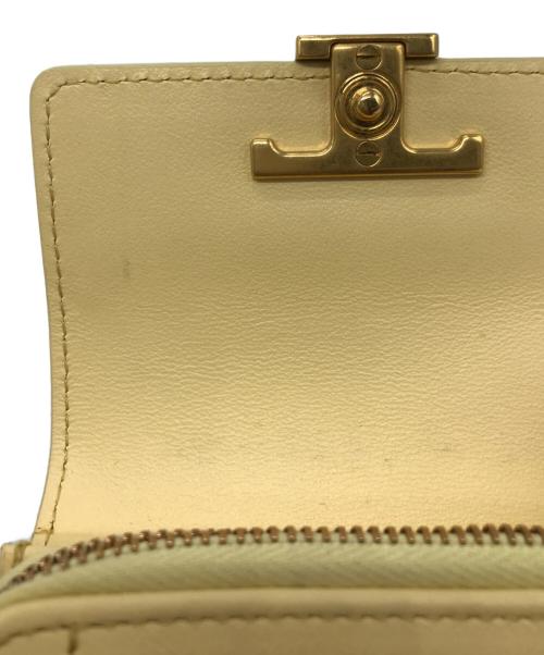 TOD'S（トッズ）TOD'S (トッズ) Tタイムレス2つ折り財布 イエローの古着・服飾アイテム