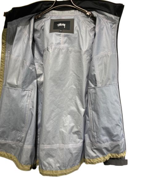 stussy（ステューシー）stussy (ステューシー) マウンテンパーカー シェルジャケット ナイロンジャケット グレー×ベージュ サイズ:Lの古着・服飾アイテム