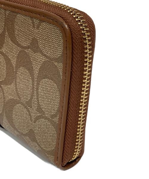 COACH（コーチ）COACH (コーチ) シグネチャー財布 ブラウンの古着・服飾アイテム