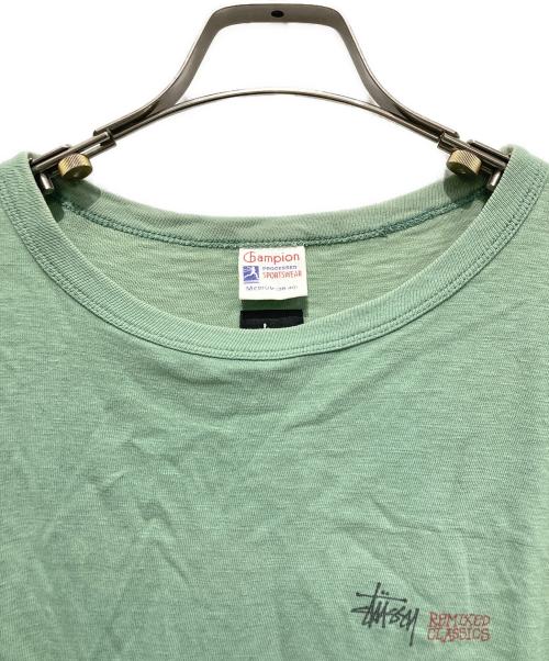 Champion（チャンピオン）Champion (チャンピオン) stussy (ステューシー) ツイストガール プリントTシャツ グリーン サイズ:Mの古着・服飾アイテム