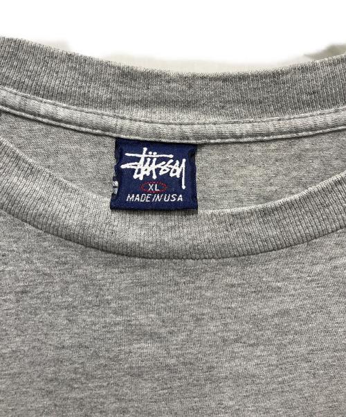 OLD STUSSY（オールドステューシー）OLD STUSSY (オールドステューシー) シャドーマンプリントTシャツ 紺タグ　90’S グレー サイズ:XLの古着・服飾アイテム