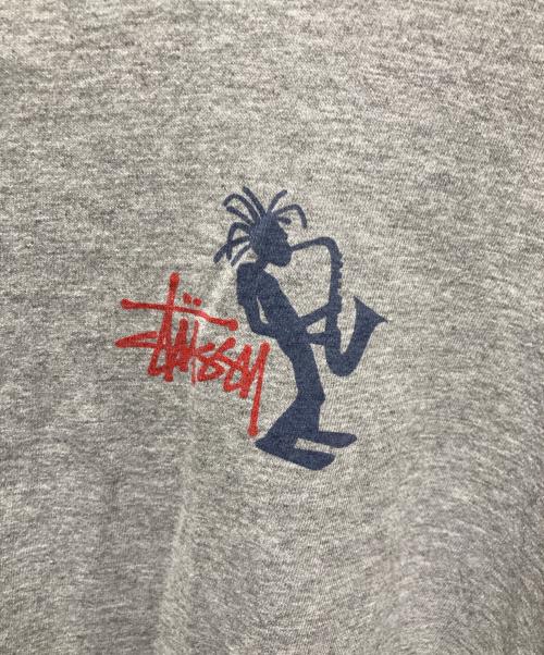 OLD STUSSY（オールドステューシー）OLD STUSSY (オールドステューシー) シャドーマンプリントTシャツ 紺タグ　90’S グレー サイズ:XLの古着・服飾アイテム