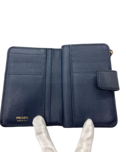 PRADA（プラダ）PRADA (プラダ) サフィアーノ コンパクトウォレット ネイビーの古着・服飾アイテム