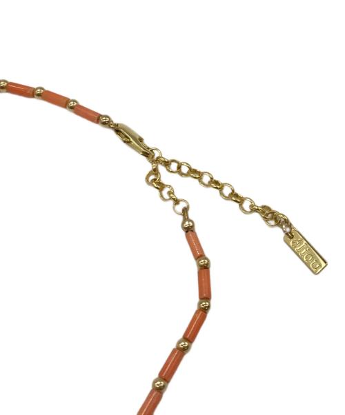 eliou（エリゥ）eliou (エリゥ) TAYOネックレス　TOMORROWLAND取り扱い オレンジの古着・服飾アイテム