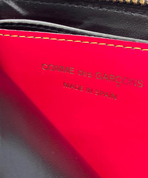 COMME des GARCONS（コムデギャルソン）COMME des GARCONS (コムデギャルソン) 2つ折り財布 オレンジ×イエローの古着・服飾アイテム