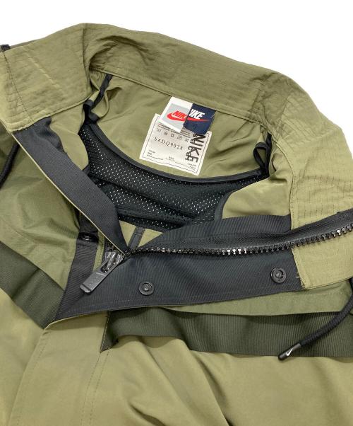 NIKE（ナイキ）NIKE (ナイキ) sacai (サカイ) NRG TRENCH JACKET カーキ サイズ:Ⅼの古着・服飾アイテム