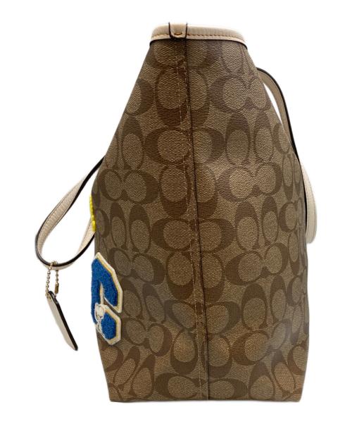 COACH（コーチ）COACH (コーチ) PEANUTS (ピーナッツ) コーティングキャンバスシグネチャートートバッグ ブラウン×ホワイトの古着・服飾アイテム