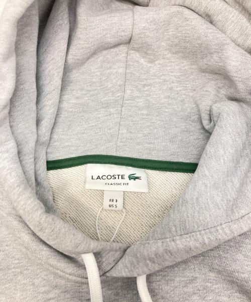 LACOSTE（ラコステ）LACOSTE (ラコステ) モノグラムレイヤードオーバルロゴスウェットフーディー グレー サイズ:3の古着・服飾アイテム