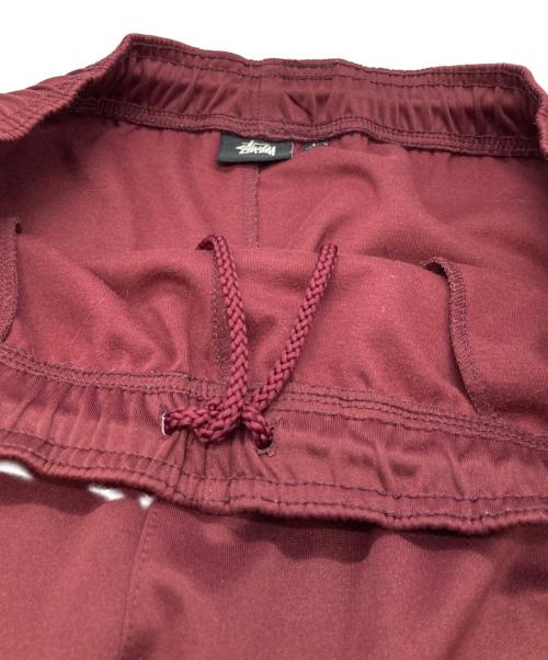 stussy（ステューシー）stussy (ステューシー) トラックパンツ レッド サイズ:Ⅼの古着・服飾アイテム