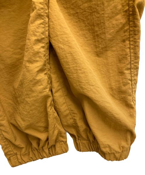 nagonstans（ナゴンスタンス）nagonstans (ナゴンスタンス) 21AW ライトシェルタフタトラックパンツ オレンジ サイズ:Sの古着・服飾アイテム