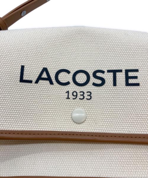 LACOSTE（ラコステ）LACOSTE (ラコステ) ヘリテージキャンバス フラップクローズコットンショルダーバッグ アイボリー サイズ:-の古着・服飾アイテム