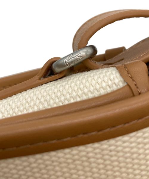 LACOSTE（ラコステ）LACOSTE (ラコステ) ヘリテージキャンバス フラップクローズコットンショルダーバッグ アイボリー サイズ:-の古着・服飾アイテム