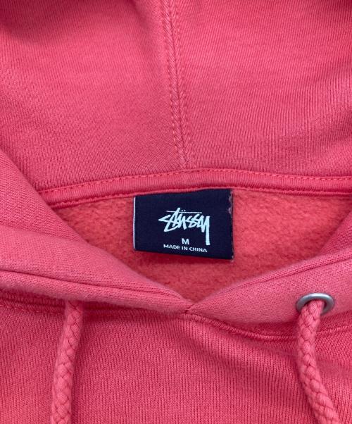 stussy（ステューシー）stussy (ステューシー) 8 Ball Man Embroidered Hoodie オレンジ サイズ:SIZE Mの古着・服飾アイテム