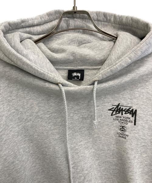 stussy（ステューシー）stussy (ステューシー) WORLD TOUR HOODIE グレー サイズ:XLの古着・服飾アイテム