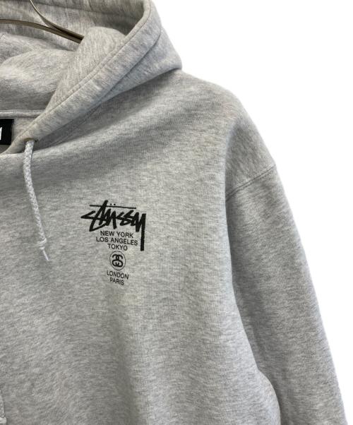 stussy（ステューシー）stussy (ステューシー) WORLD TOUR HOODIE グレー サイズ:XLの古着・服飾アイテム