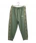 MAISON KITSUNE（メゾンキツネ）の古着「FLASH FOX TRACK PANTS」｜グリーン