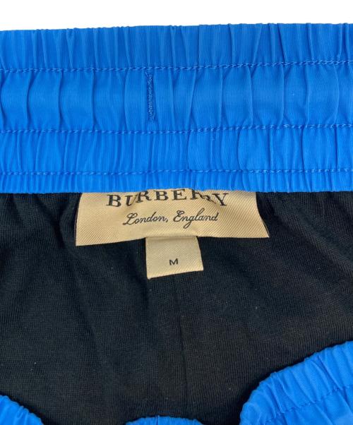 BURBERRY（バーバリー）BURBERRY (バーバリー) サイドラインボタンナイロンパンツ ブルー サイズ:SIZE Mの古着・服飾アイテム