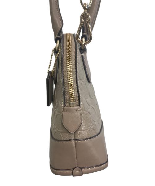 COACH（コーチ）COACH (コーチ) シグネチャー 2WAY ハンドバッグ ベージュの古着・服飾アイテム