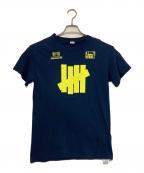 UNDEFEATEDアンディフィーテッド）の古着「プリントTシャツ」｜ネイビー
