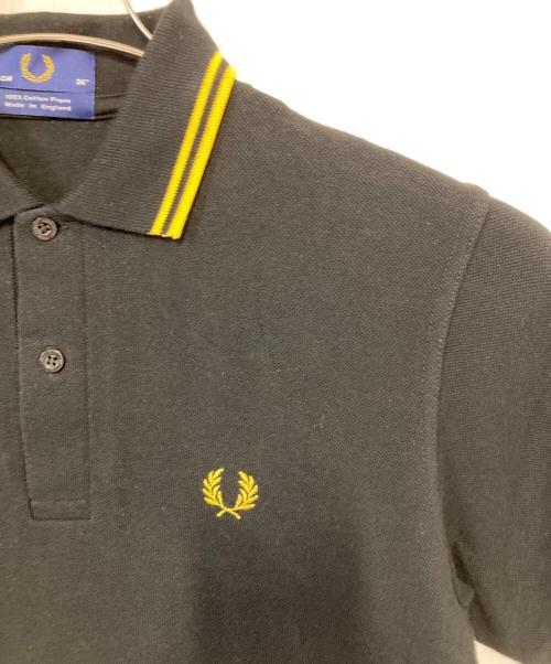 FRED PERRY（フレッドペリー）FRED PERRY (フレッドペリー) ポロシャツ ブラック×イエロー サイズ:36の古着・服飾アイテム