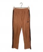 adidasアディダス）の古着「BECKENBAUER コットントラックパンツ」｜オレンジ