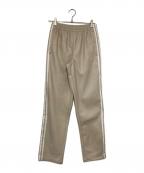 adidasアディダス）の古着「フェイクレザーアディカラースリーストライプスファイヤーバードトラックスーツパンツ」｜ベージュ