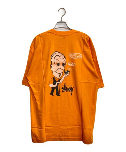 stussy（ステューシー）stussy (ステューシー) SMOKING LOGO OLD MAN T / スモーキンオールドマンロゴタバコTシャツ オレンジ サイズ:XLの古着・服飾アイテム