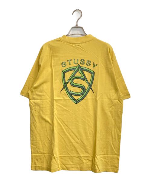 stussy（ステューシー）stussy (ステューシー) EMBLEM LOGO T / エンブレムロゴTシャツ イエロー サイズ:XLの古着・服飾アイテム